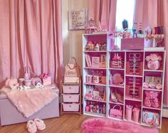 a room filled with lots of pink furniture and accessories