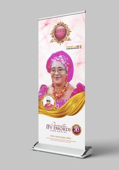 a roll up banner with an image of a woman in pink and gold on it