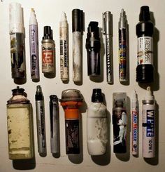 many different types of pens and ink bottles