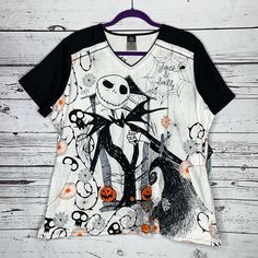 Tooniforms By Cherokee - Disney The Nightmare Before Christmas Size Xl Jack & Sally Halloween Scrub Top. V-Neckline. 2 Pockets. Side Slits At Hemline. Short Sleeves. Body Is Cotton - Sleeves, Yoke & Neck Band Are Polyester/Cotton Blend. Nwt, Brand New With Tags. Length Is 28” & Bust Is 24”. Measurements Taken While Garment Is Laying Flat. Halloween Scrubs, Jack And Sally, The Nightmare Before Christmas, The Nightmare, Disney Tops, Scrub Tops, Nightmare Before, Nightmare Before Christmas, Before Christmas