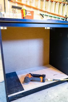 a toolbox with tools in it sitting on the floor