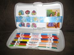 an open case with many different colored pens in it