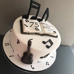 a white cake with musical notes on it