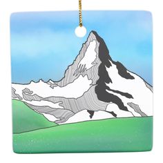 a glass ornament with a mountain in the background