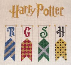 a cross stitch pattern with the words harry potter and four different pennants on it