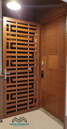 an open wooden door with metal bars on the sides and side panels that are interlocked