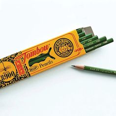 two green pencils sitting next to each other