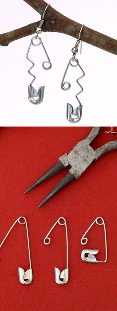 three pairs of scissors and some wire on a red table next to a pair of earrings