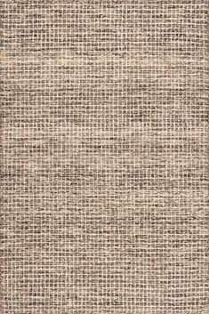 an area rug with brown and beige colors