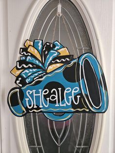 a door hanger with a mickey mouse shoe on it's side and the word shalao painted on it