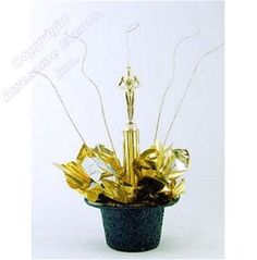 a small potted plant with gold leaves and a statue in it's center