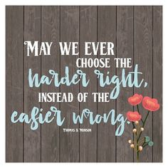 a wooden wall with a quote on it that says, may we ever choose the harder light instead of the easier wrong