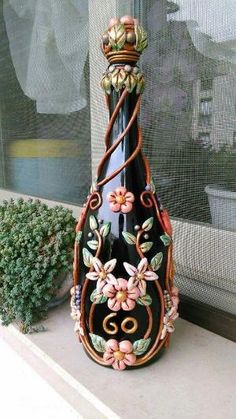 a decorative vase sitting on top of a window sill