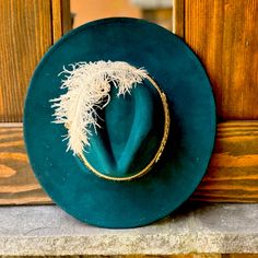 This Uniquely Designed Beautiful Teal Hat Is Made Uniquely Yours. With An Arrow Belt Hat Spanning The 9 1/2 Inch Brim, You Will Stand Out In Any Crowd. Elegant Handmade Cap Style Hat, Elegant Handmade Cap Hat, Elegant Handmade Felt Hat For Kentucky Derby, Elegant Handmade Hats One Size Fits Most, Elegant Handmade Hat, One Size Fits Most, Elegant Handmade Fedora Hat, Elegant Handmade Felt Fedora Hat, Handmade Elegant Fedora For Kentucky Derby, Elegant Adjustable Felt Cap