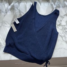 Nwt Navy Sweater Tank From Aritzia With Open Back Detail! Super Cute, Perfect For Summer! Babaton Sculpt Knit Tank Outfit, Fitted Soft Knit Blue Top, Fitted Blue Soft Knit Top, Fitted Knit Sweater Vest In Blue, Fitted Sleeveless Blue Sweater, Aritzia Tank Top, Blue V-neck Knitted Top, Blue Ribbed Tank Top, Navy Fitted Knitted Top