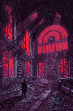 a man standing in an abandoned building with red light coming through the windows