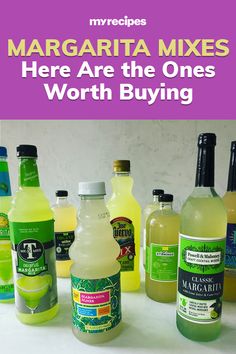 there are many bottles of margarita mixes on the table with text overlay that says margarita mixes here are the ones worth buying