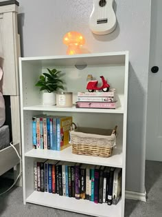 a white book shelf with books on it