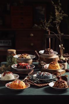 a table topped with lots of different types of desserts