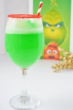 a green drink sitting on top of a table