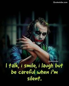 the joker with his arms crossed, saying i talk smile laugh but be careful when i'm silent