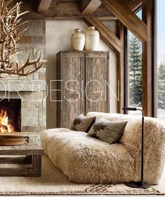 a living room filled with furniture and a fire place in front of a stone fireplace