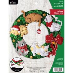 the crafty kit includes a wreath with cats and kittens on it, including an ornament