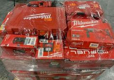 several milwaukee power tools are wrapped in plastic and ready to be shipped into the store