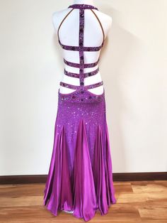 a woman's purple and white belly dance costume