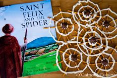 the book saint felix and the spider is next to some pretzel treats on a table