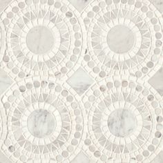 an intricately designed marble wallpaper with circles and dots in the center, on a white background