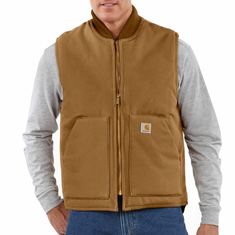 Men's, Water Repellent and Wind Resistant, 12 oz Firm Hand Duck. A great extra layer. Features12-ounce, heavyweight firm-hand, 100% ring-spun cotton duck. Water repellent and Wind resistant. Nylon lining quilted to arctic-weight 100% polyester insulationBrass center-front zipper with inside storm flapInside pocket with hook-and-loop closureTwo large lower-front pocketsDrop tailModel height: 6'; Chest size: 40"; Wearing size MModel No. OV0001-MCountry of Origin: Imported | Carhartt Men's Polyeste Carhartt Vest, Collar Vest, Men Carhartt, Warm Dresses, Tool Belt, Vests Mens, Outerwear Vest, Carhartt Mens, Diamond Quilt