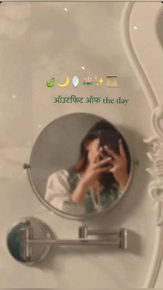 a woman taking a selfie in front of a mirror with the caption happy mother on it