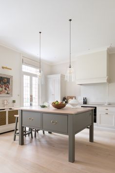 a large kitchen island in the middle of a room