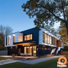 Check out this stunning shipping container house!  The sleek ultra-modern design in white, blue, black, and brown is a perfect inspiration for your own container home. Share with us what you're planning to build!  #containerhouse #designinspiration #tinyhouse Modular Home Designs, Building A Container Home, Building House, Container House Plans, Shipping Container House, Container Home, Container House Design