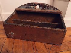 an old wooden box sitting on the floor