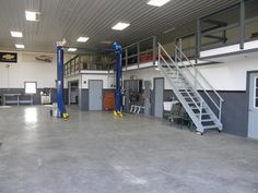 the inside of a building with stairs and other equipment