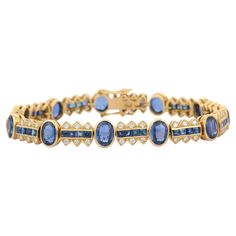 Blue Sapphire and Diamond bracelet in 18K Gold. It has a perfect oval and square cut gemstone to make you stand out on any occasion or an event. A tennis bracelet is an essential piece of jewelry when it comes to your wedding day. The sleek and elegant style complements the attire beautifully, whether it's the bride wearing it herself, or as a gift to her bridesmaids to wear on the D’day. Bracelets are worn to enhance the look. Women love to look good. It is common to see a woman rocking a lovel Luxury Blue Oval Tennis Bracelet, Bracelet Tennis, Gold Armband, Square Stone, Sapphire Bracelet, Tennis Bracelet Diamond, Sapphire Stone, Square Cut, D Day