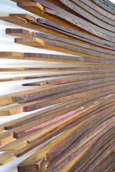 wooden slats are lined up against the wall