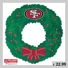 a green wreath with a kansas chiefs logo on it and a bow around the front