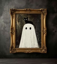 a black cat sitting on top of a white ghost in a gold framed art print