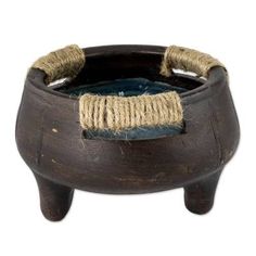 a wooden bowl with rope wrapped around it