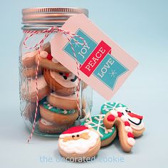 some cookies in a glass jar with a tag on it