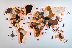 the world map is made out of wooden pieces