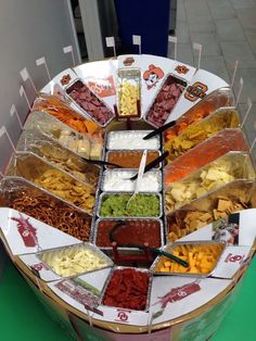 a platter filled with lots of different types of food on top of a table