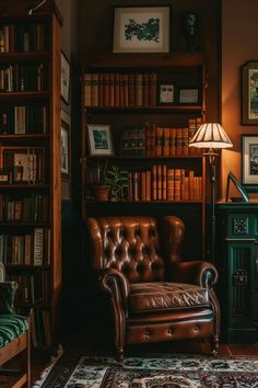 a leather chair sitting in front of a book shelf filled with books