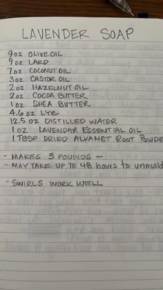 a handwritten recipe for lavender soap on top of a piece of lined notebook paper