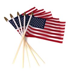 several american flags are lined up on top of each other with toothpicks sticking out of them