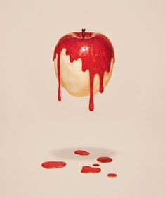 an apple is dripping with blood on it