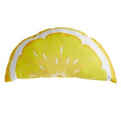 a lemon slice pillow on a white background